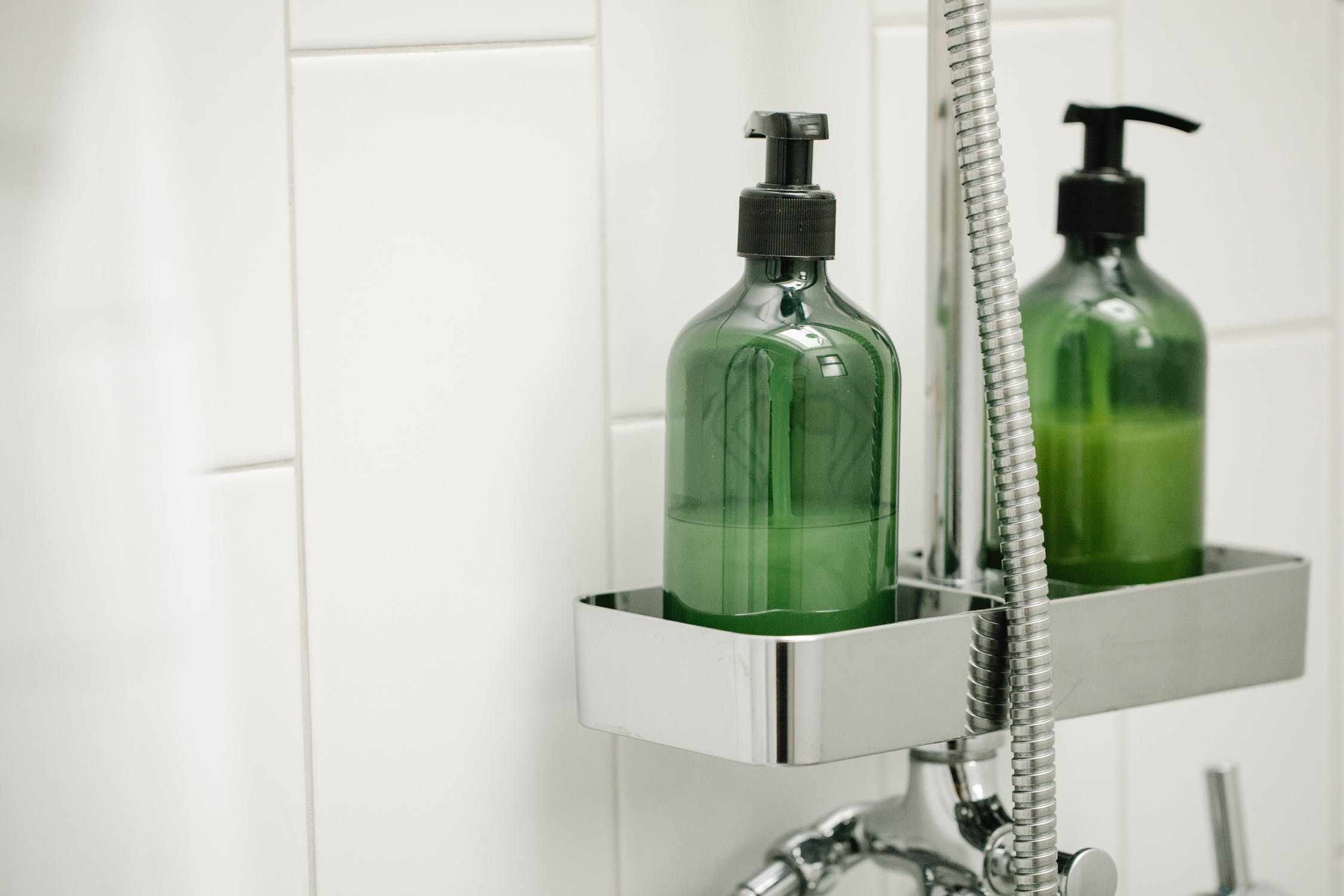 unlabeled shampoo and conditioner bottles
