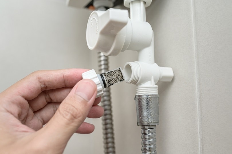 Close-up dirty on tap water filter valve_spyarm_shutterstock