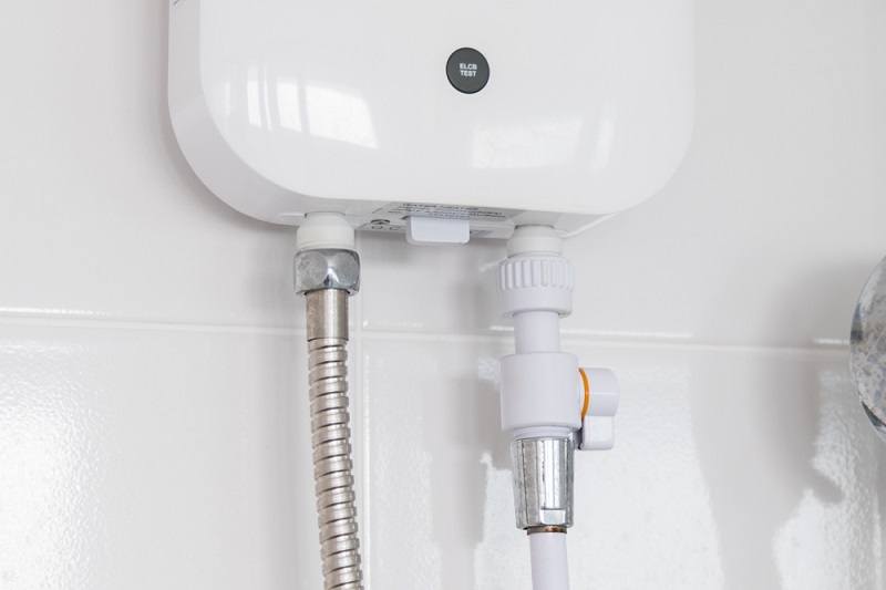 Instant tankless electric water heater installed_kensoftTH_shutterstock