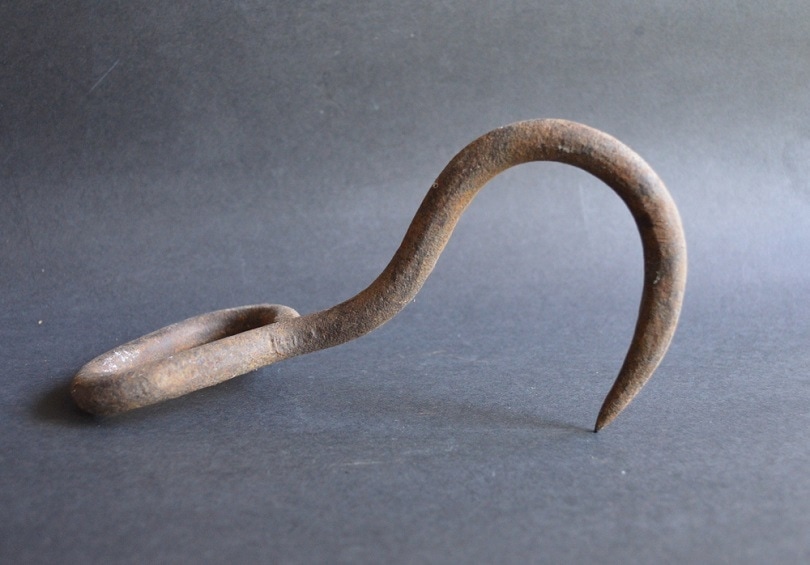 Old Rusty Cast Iron Meat Hook_TheOldBarnDoor_shutterstock