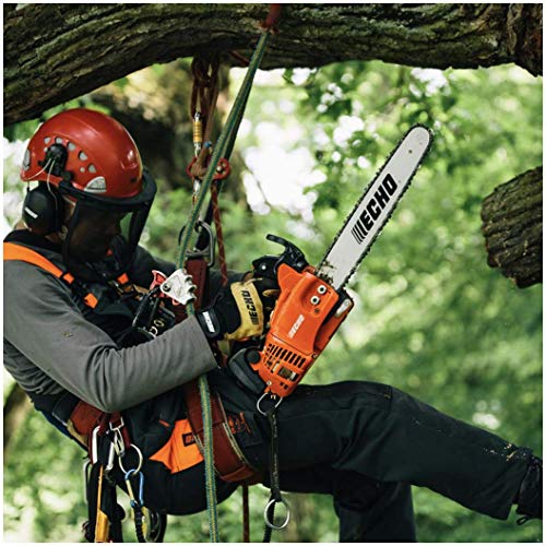 man in tree using chainsaw