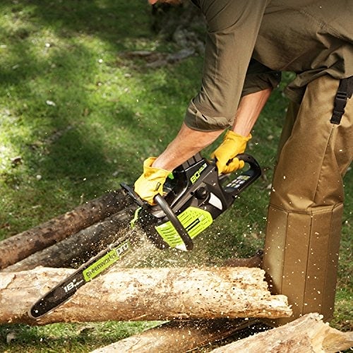 using a chainsaw in the forest