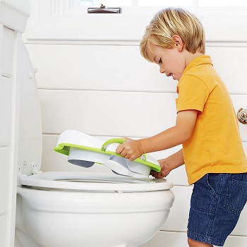Boy Putting Munchkin Toilet Seat