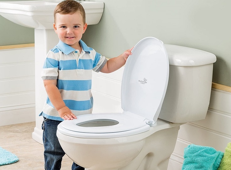 Boy Wearing Stripes near toilet