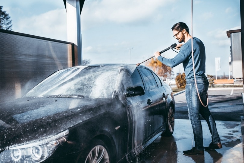Cleaning car using high pressure water_hedgehog94_shutterstock