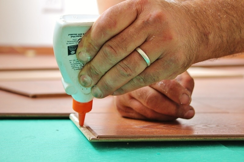 Hand Using Glue