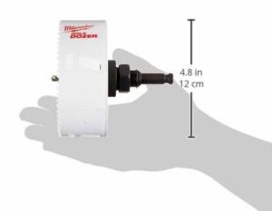 hand holding hole saw