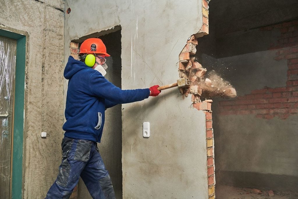 Ongoing demolition using sledgehammer