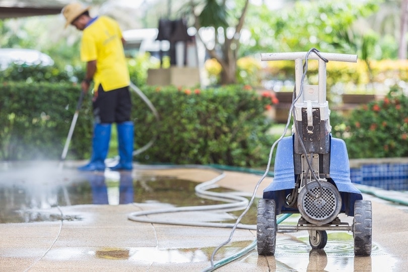 Outdoor floor cleaning with high pressure water_Piyawat Nandeenopparit_shutterstock