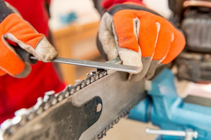 Sharpening a chainsaw close up