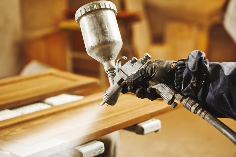 Staining wood with white spray gun_il21_shutterstock