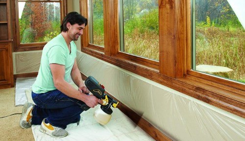 a wood wall being painted