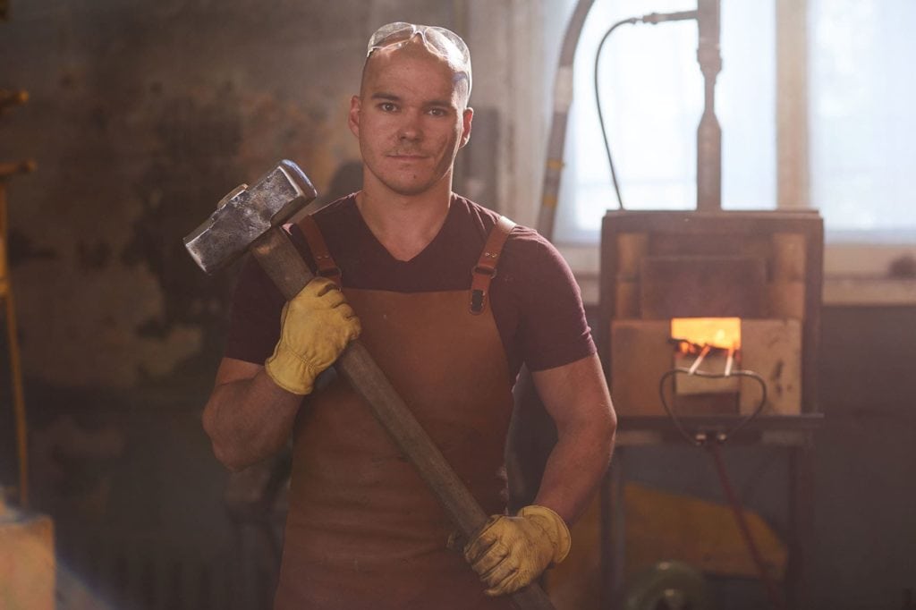 blacksmith holding sledgehammer