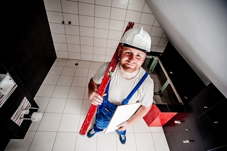 builder installing tile