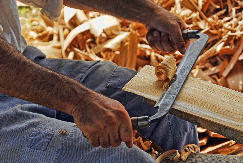carpenter using planer