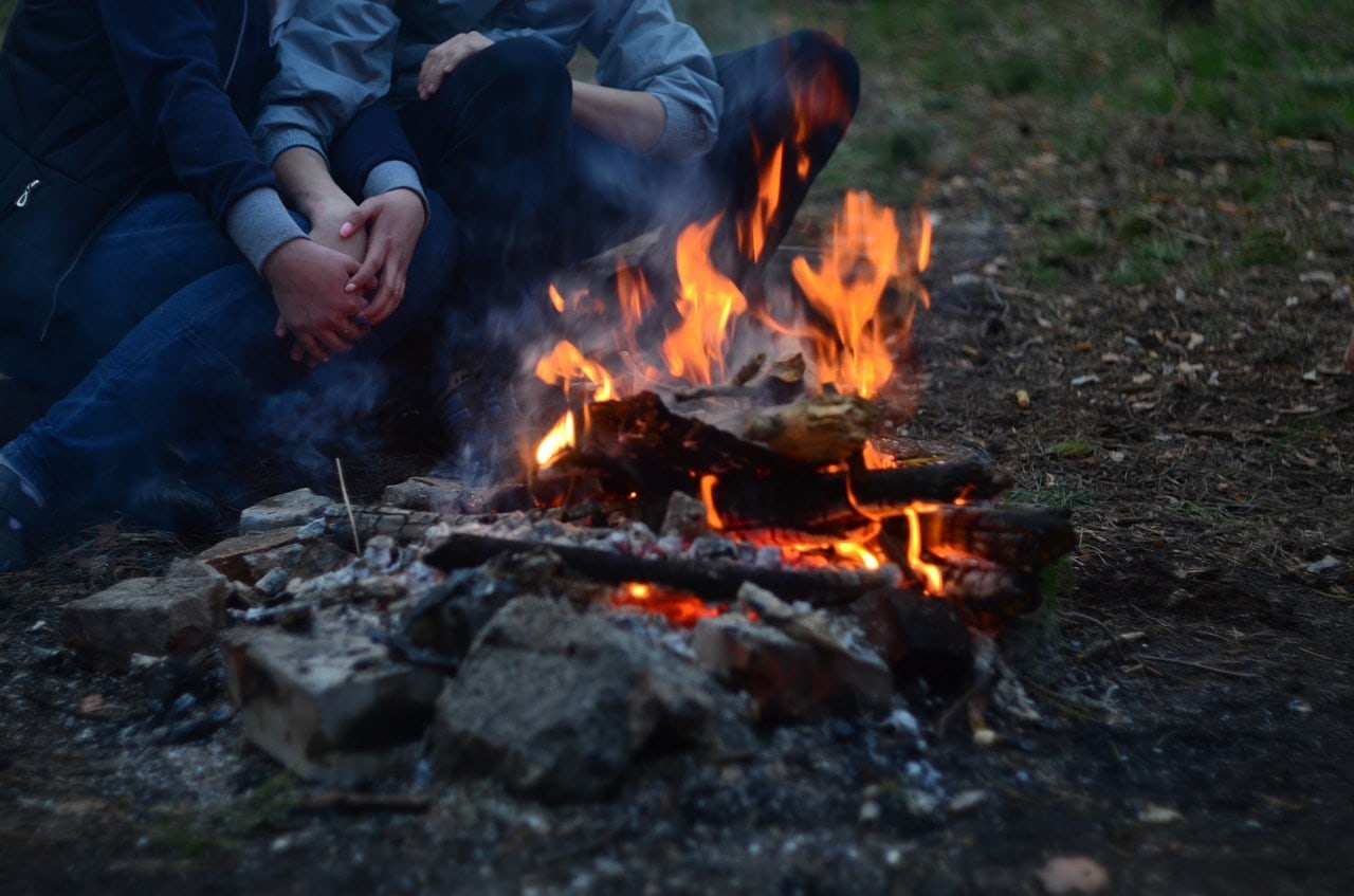 couple near campfire