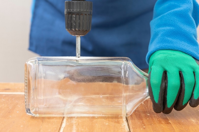 drill-makes-a-hole-in-a-glass-bottle_Manuel-Trinidad-Mesa_shutterstock