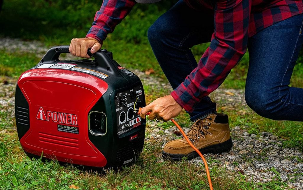 hand plugging in A-iPower Portable Inverter Generator