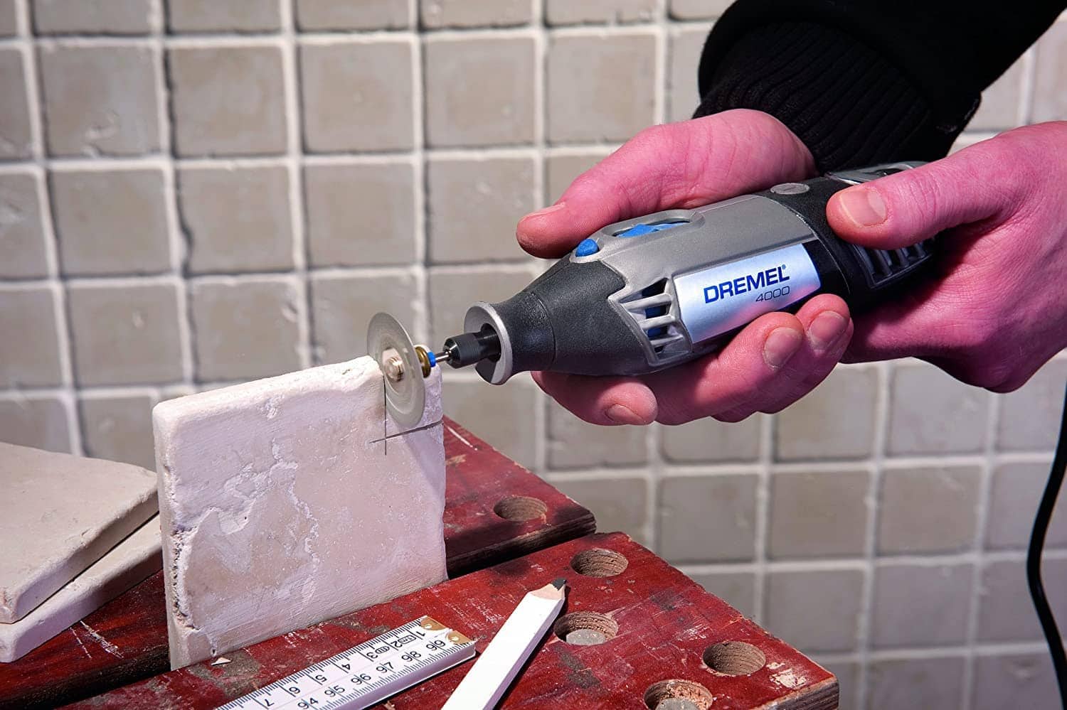 hand using Dremel 4000 Rotary Tool Kit