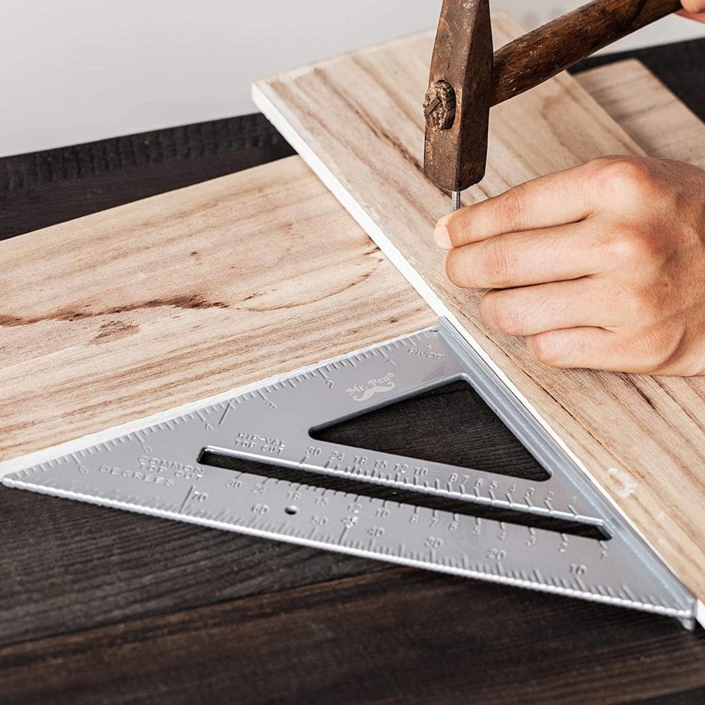 hand using Mr. Pen Metal Rafter Square