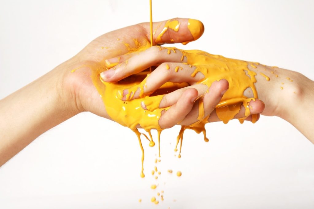 hands with paint