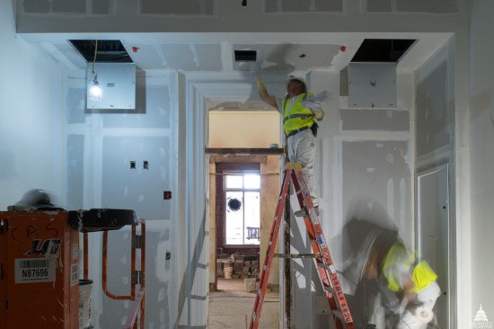 handyman works on ceiling