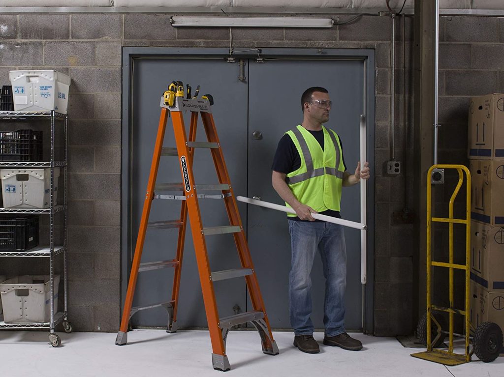 man beside Louisville 6' Fiberglass Step Ladder