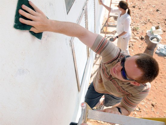 man cleaning the wall
