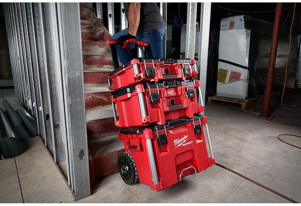 man pulling Milwaukee Rolling Modular Tool Box