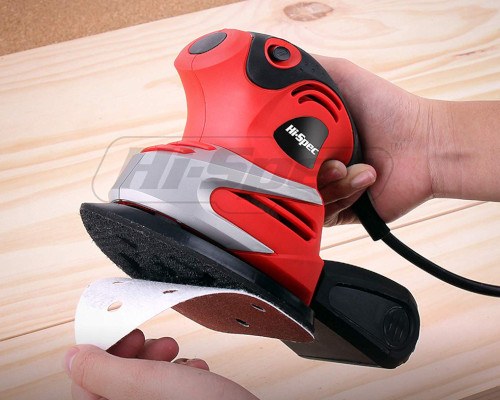 man removing sanding pad