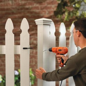 man using BLACK+DECKER DR260C Corded Drill