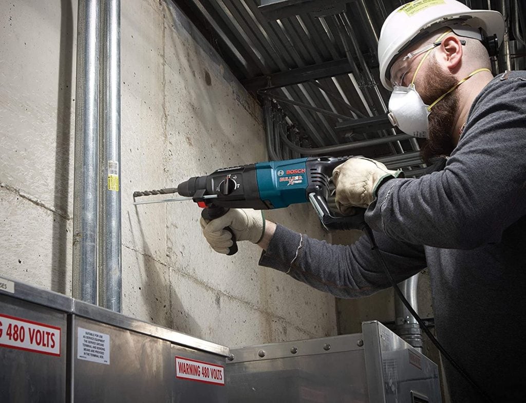 man using Bosch Bulldog Xtreme Hammer Drill