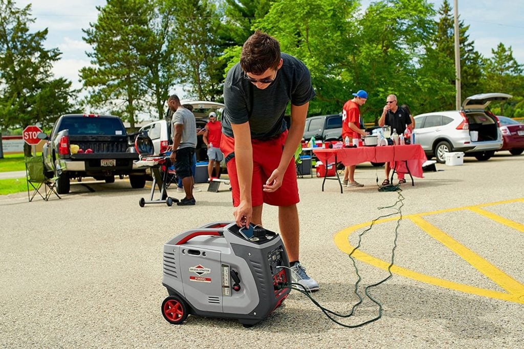 man using Briggs & Stratton P3000 Inverter Generator