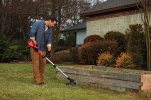 man using CRAFTSMAN CMCST910M1 String Trimmer : Edger