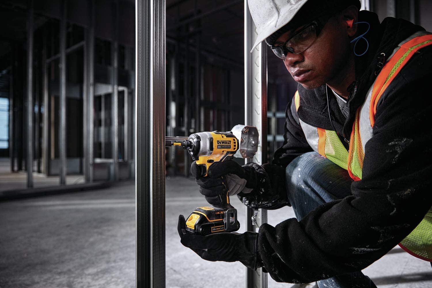 man using DEWALT ATOMIC DCF809C1 Impact Driver