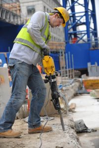 man using DEWALT D25960K Demolition Hammer