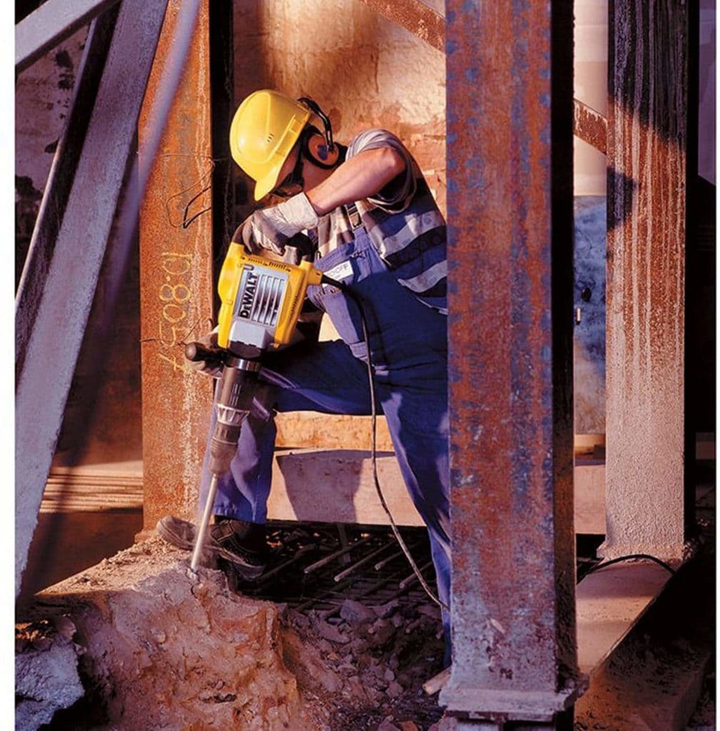 man using DEWALT Demolition Hammer