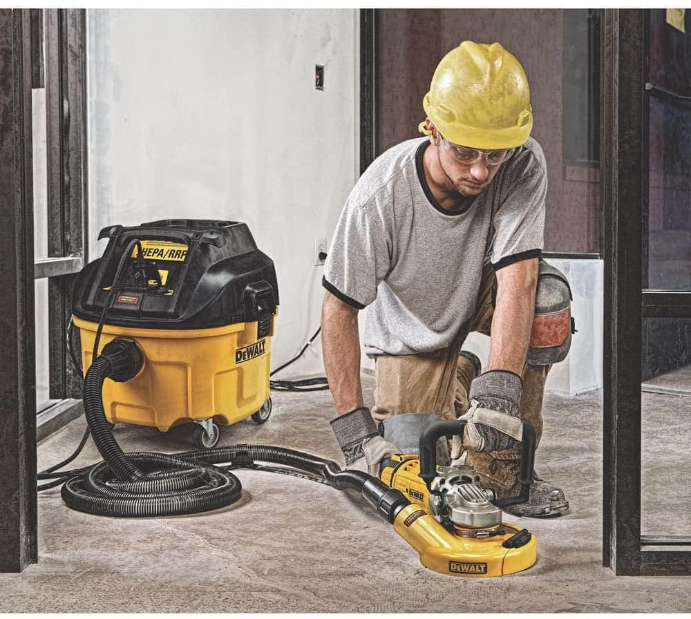 man using DEWALT Dust Extractor