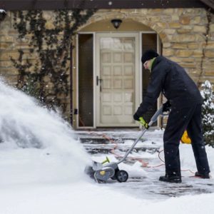 man using Earthwise SN70016 Electric Snow Shovel
