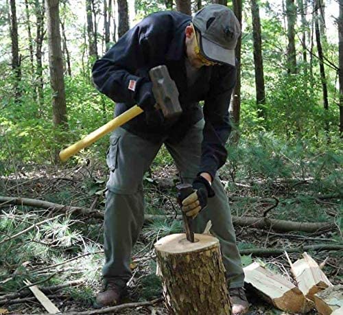 man using Edward Tools Classic Log Splitting Wedge