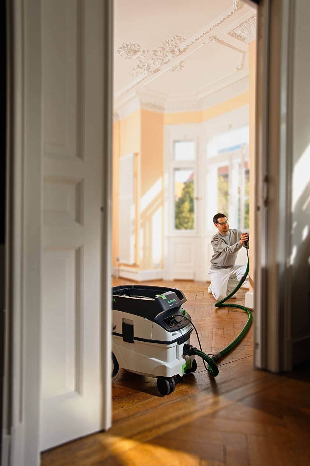 man using Festool 583492 CT 26 E HEPA Dust Extractor