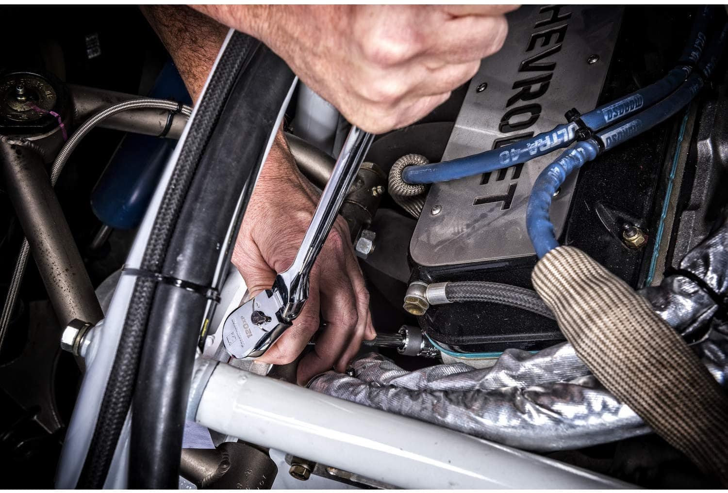 man using GEARWRENCH 3:8 Flex Head Teardrop Ratchet