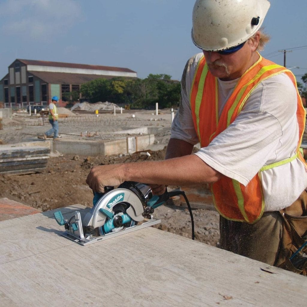 man using Makita 5377MG Magnesium Hypoid Saw