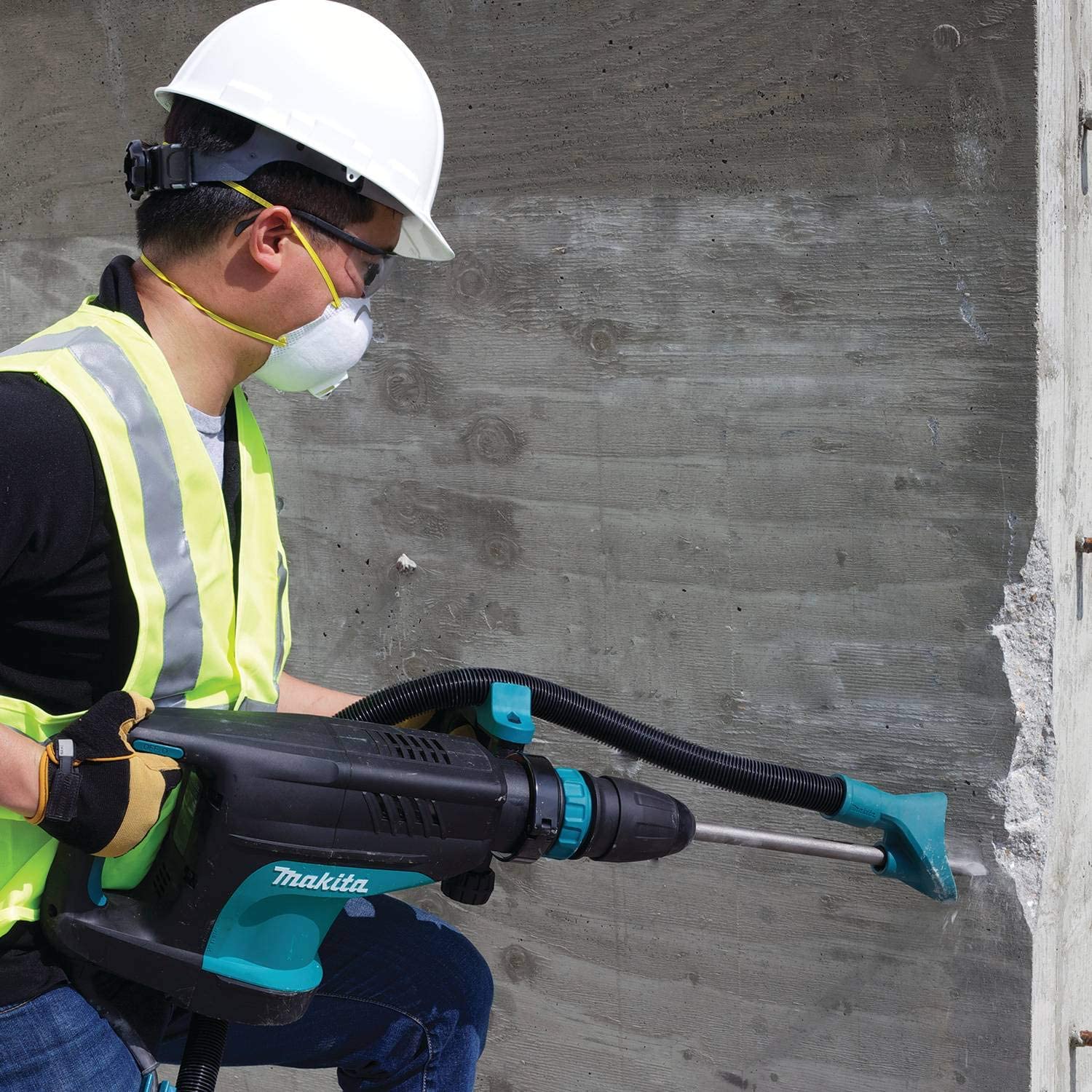 man using Makita HM1203C SDS Max Demolition Hammer