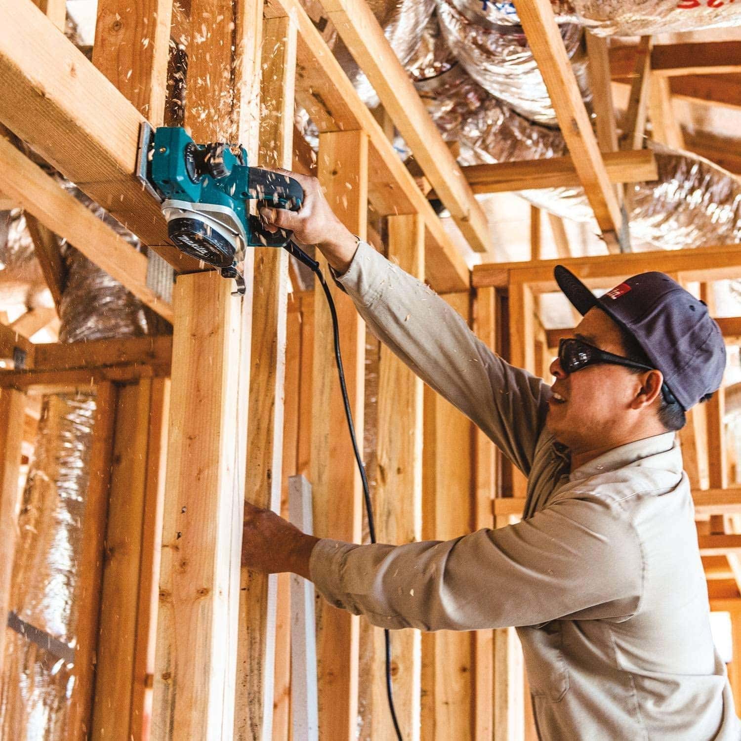 man using Makita KP0800K Hand Planer