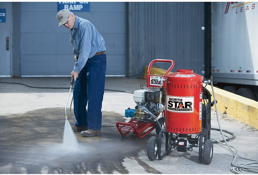 man using Northstar Electric Wet Steam Cleaner and Hot Water Commercial Pressure Power Washer