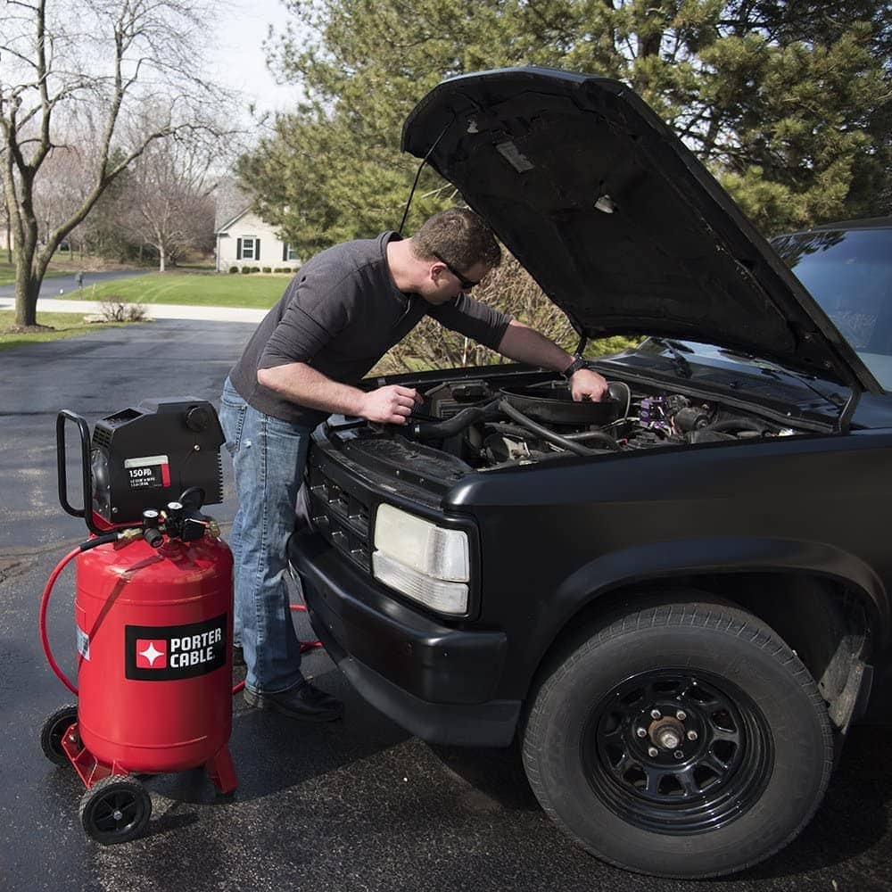 man using Porter Cable PXCMF220VW Portable Air Compressor