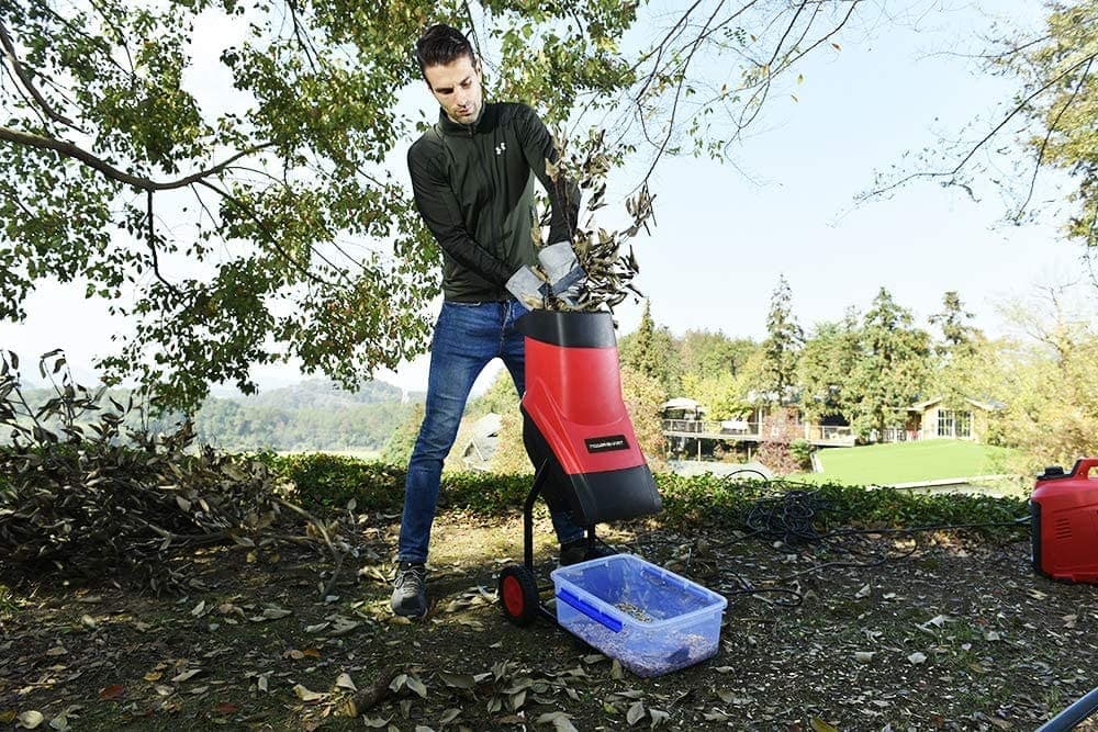 man using PowerSmart PS10 15-Amp Electric Wood Chipper
