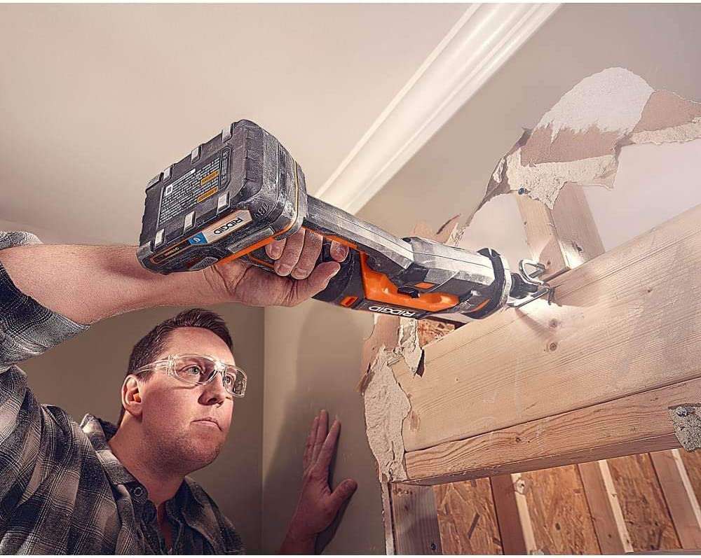 man using Ridgid 18-Volt Octane Cordless Brushless One-Handed Reciprocating Saw