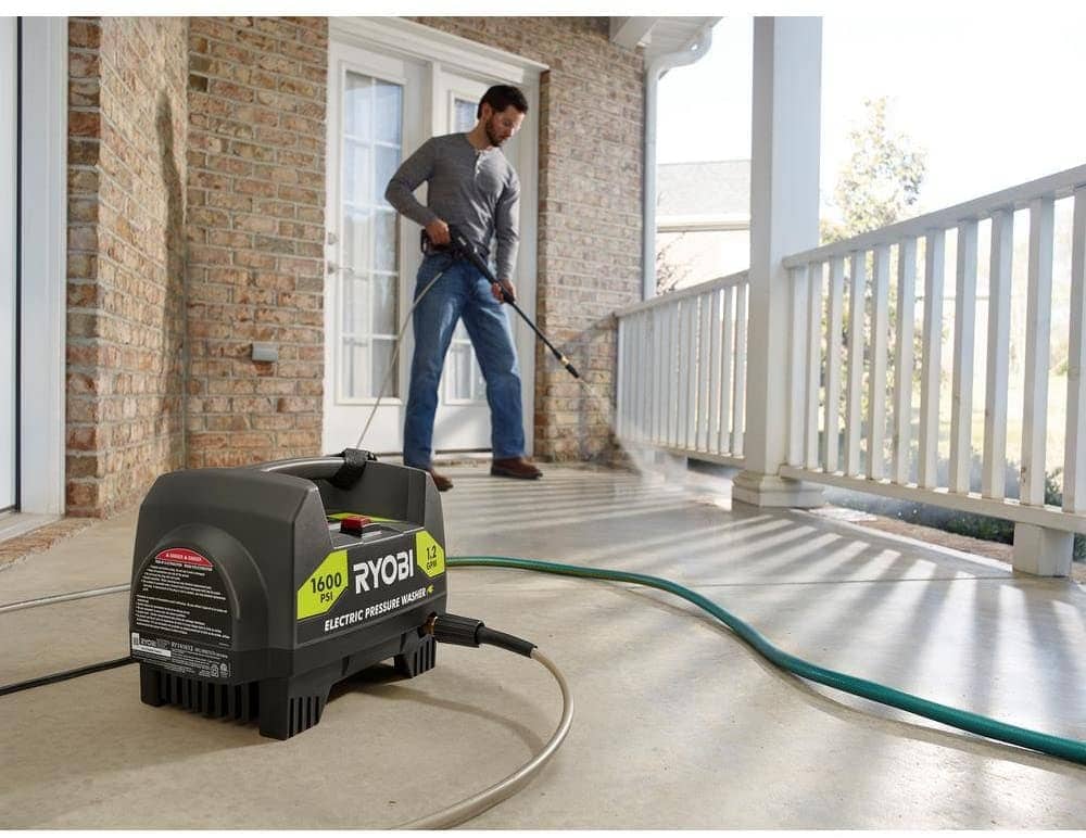 man using Ryobi RY141612 Electric Pressure Washer